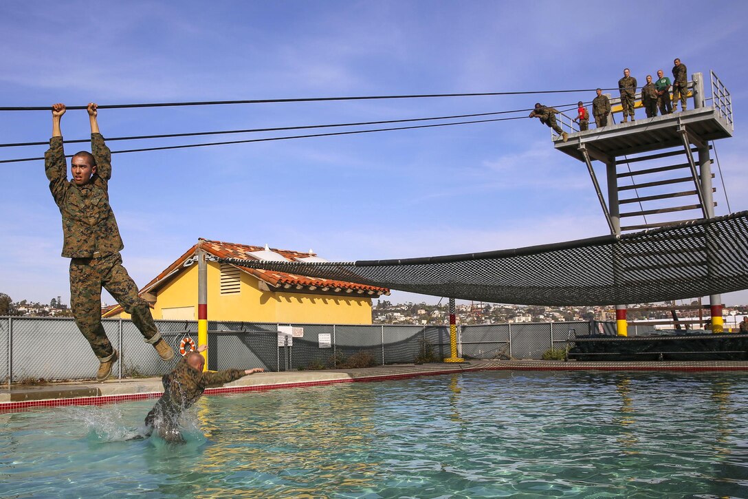 Marine Corps recruits negotiate the slide-for-life obstacle on the confidence course at Marine Corps Recruit Depot San Diego, Feb. 23, 2016. Marine Corps photo by Lance Cpl. Angelica I. Annastas 