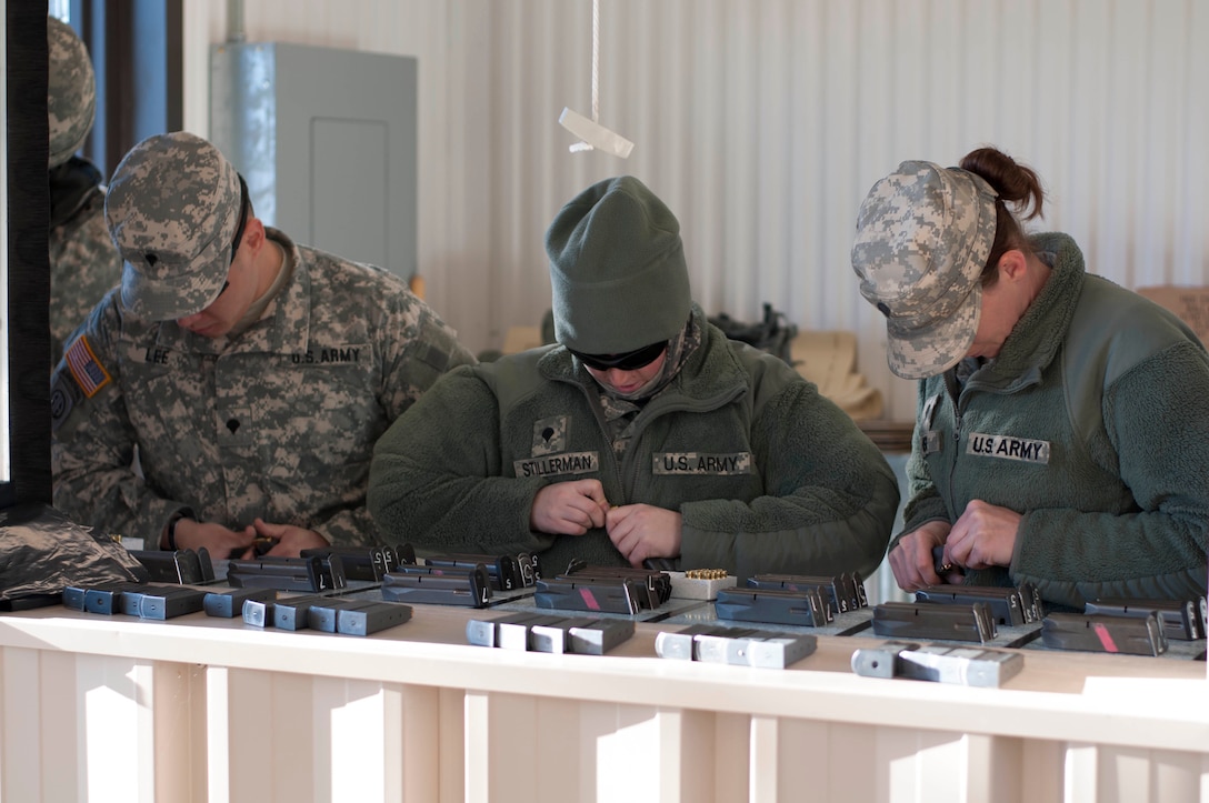 U.S. Army Reserve Soldiers competing in this year's combined 310th ESC and 3rd Transportation Brigade Expeditionary Best Warrior Competition, held at Fort A.P. Hill, Va., Feb. 26 through March 2. Day 1 of the 310th ESC Best Warrior Competition included the Soldier essay competition, AWT station testing lanes and the Army standard written exam. Day 2 included M9 qualification, M16 qualification and land navigation.