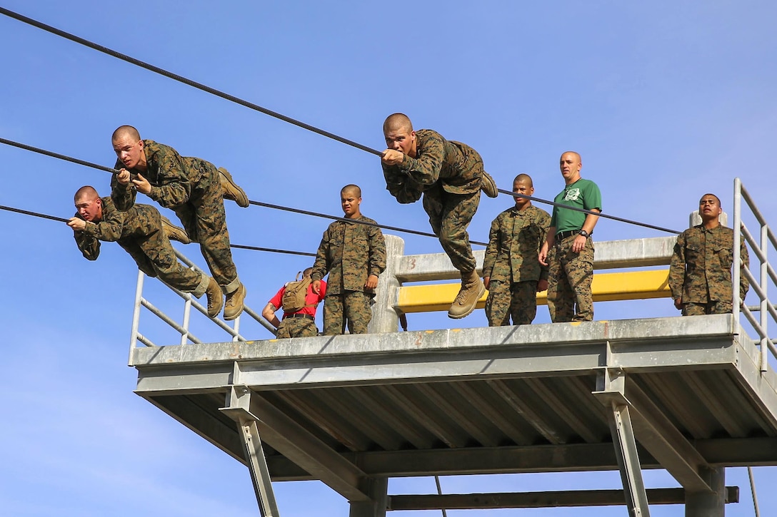 Marine Corps recruits tackle the slide-for-life obstacle on the confidence course at Marine Corps Recruit Depot San Diego, Feb. 23, 2016. Marine Corps photo by Lance Cpl. Angelica I. Annastas 