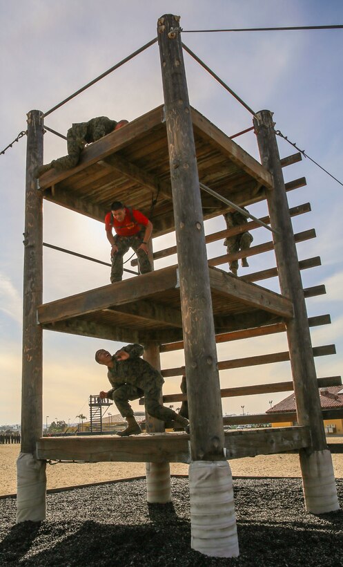 Marine Corps recruits negotiate the tower obstacle on the confidence course at Marine Corps Recruit Depot San Diego, Feb. 23, 2016. Marine Corps photo by Lance Cpl. Angelica I. Annastas 