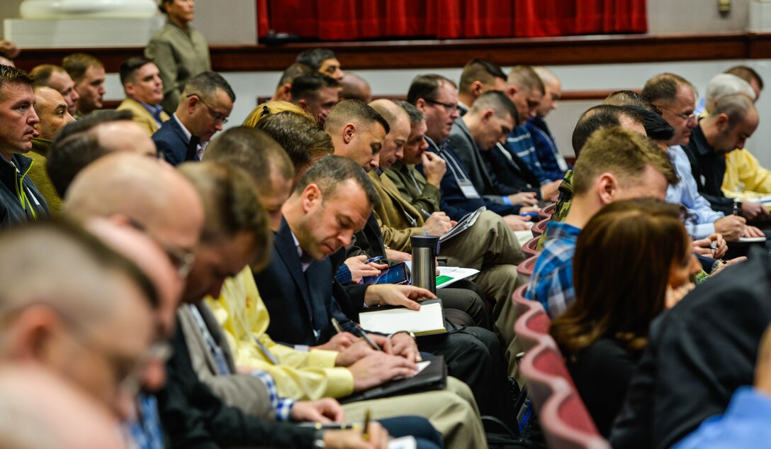 Service members and civilians from around the Department of Defense take notes during a speech at the Marine Corps Warfighting Lab’s Force Development 25 Innovation Symposium at Marine Corps Base Quantico, Virginia, Feb. 23, 2016. Speakers at the symposium included some of the world’s top innovators as well as Gen. Robert Neller, the 37th Commandant of the Marine Corps, and other top military leaders.