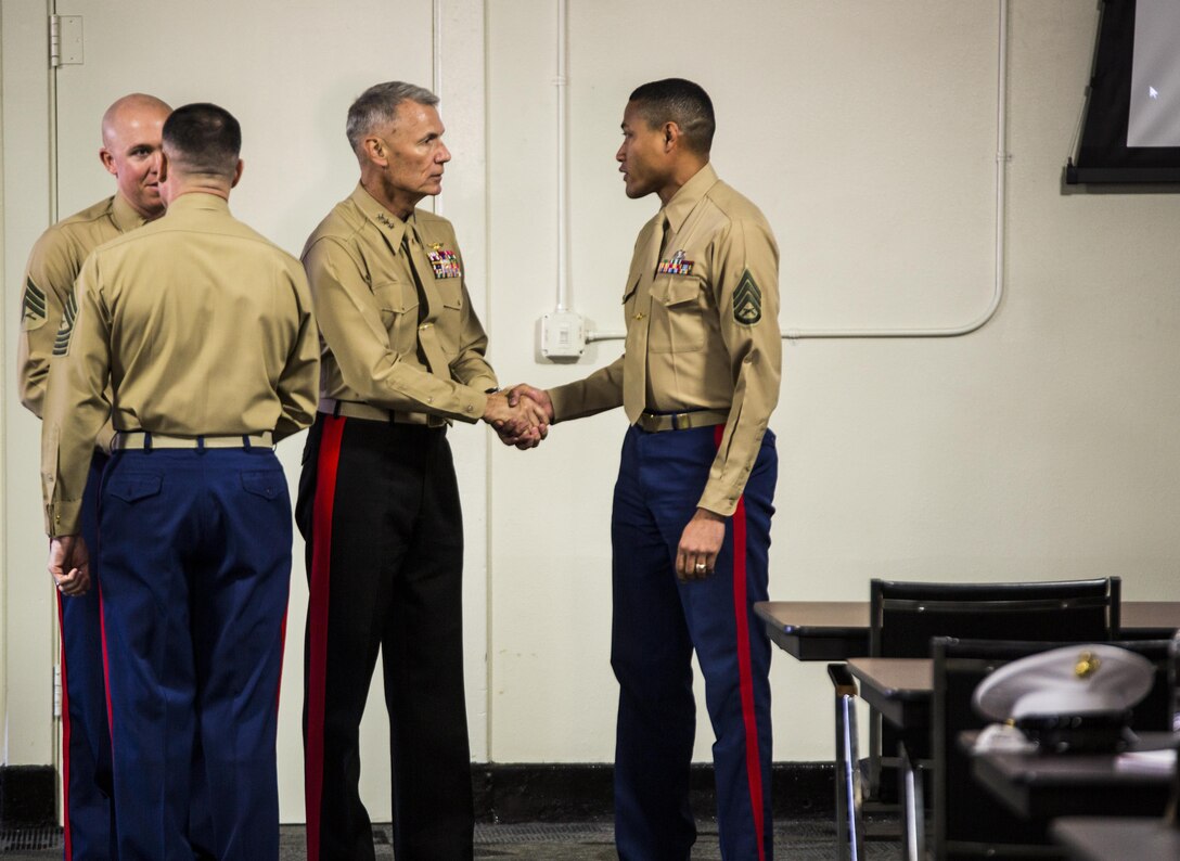 Lt. Gen. Rex C. McMillian (center left), commander of Marine Forces Reserve and Marine Forces North, congratulates a Marine nominated for Reserve Career Planner of the Year during the Reserve Career Planner Awards Presentation at Marine Corps Recruit Depot San Diego, Feb. 24, 2016. This year’s Reserve Career Planner of the Year was Sgt. Christopher Smith (left), a career planner from 3rd Air Naval Gunfire Liaison Company, Force Headquarters Group, Marine Forces Reserve and runner-up was Staff Sgt. Andrew Watson, a career planner from 4th Light Armored Reconnaissance Battalion, 4th Marine Division, Marine Forces Reserve. Sgt. Smith, Staff Sgt.Watson and many other career planners work diligently through the year to assist Marines with making future occupational decisions. 