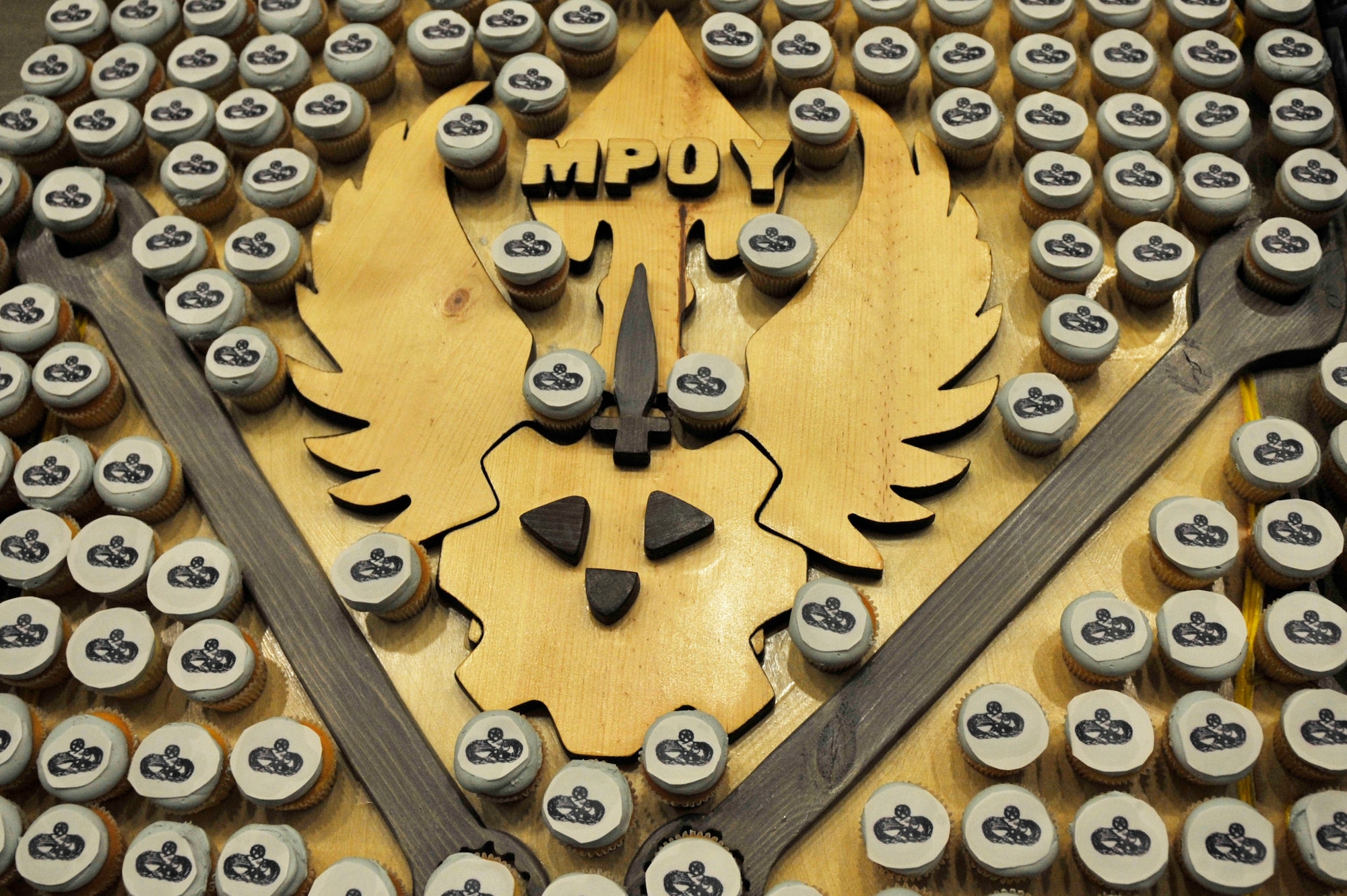 An adornment created to celebrate the night’s events serves as a dessert table during the Maintenance Professional of the Year banquet Feb. 26, 2016, at Cannon Air Force Base, N.M. The MPOY banquet is an annual event where all the squadrons within the 27th Special Operations Maintenance Group come together to celebrate individual and team achievements of the previous year. (U.S. Air Force photo/Tech. Sgt. Manuel Martinez)