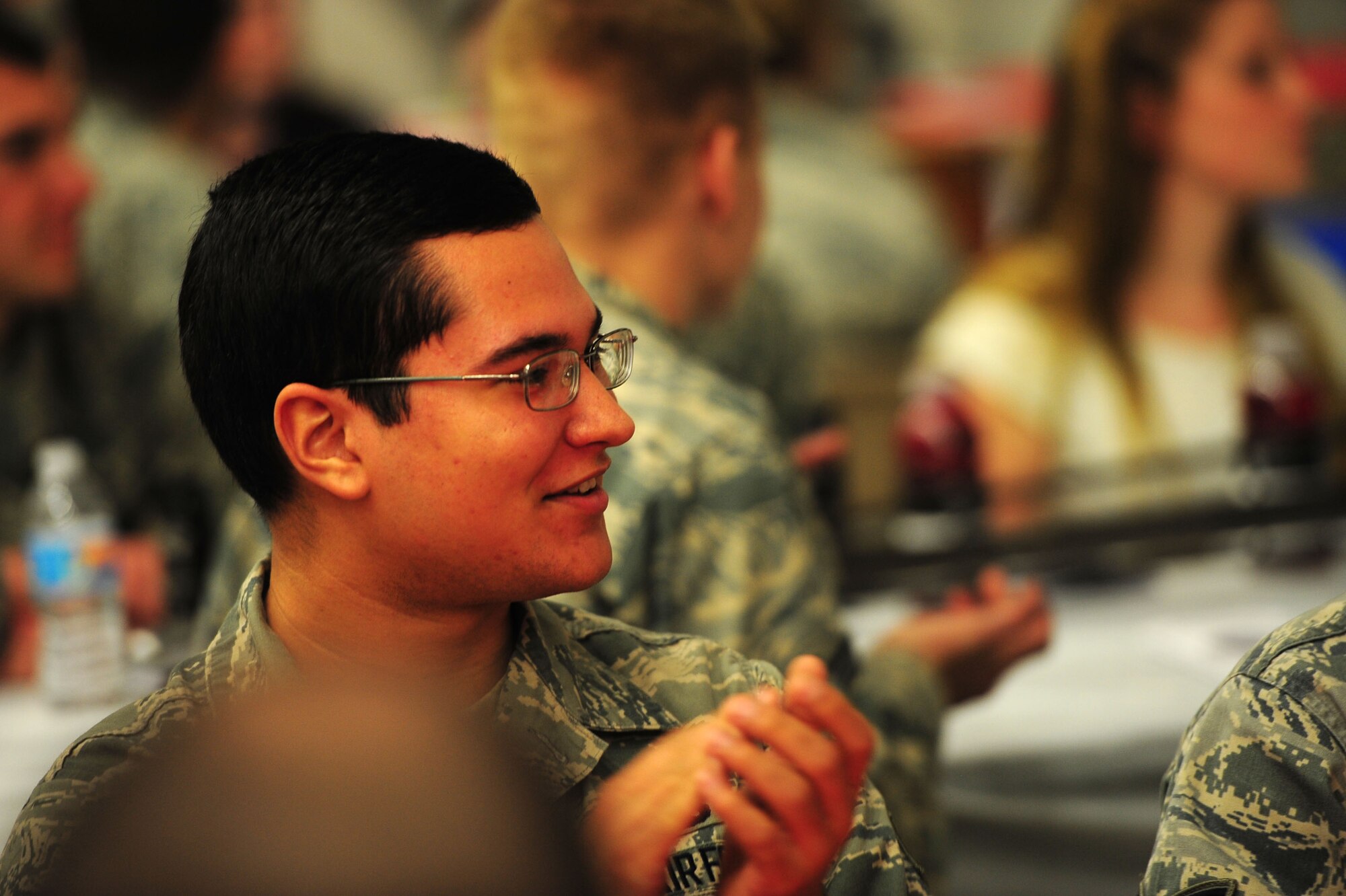 Members of the 27th Special Operations Maintenance Group and their families react to a sound-off contest during the Maintenance Professional of the Year banquet Feb. 26, 2016, at Cannon Air Force Base, N.M. The MPOY banquet is an annual event where all the squadrons within the 27th SOMXG come together to celebrate individual and team achievements. (U.S. Air Force photo/Tech. Sgt. Manuel Martinez)