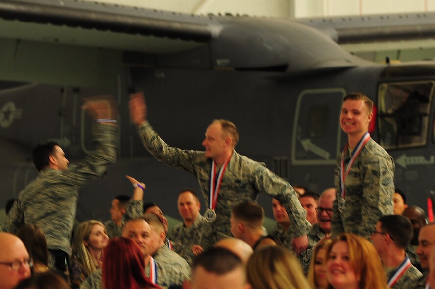 Wingmen celebrate after hearing the winner for a category during the Maintenance Professional of the Year banquet Feb. 26, 2016, at Cannon Air Force Base, N.M. The MPOY banquet is an annual event where all the squadrons within the 27th Special Operations Maintenance Group come together to celebrate individual and team achievements. (U.S. Air Force photo/Tech. Sgt. Manuel Martinez)