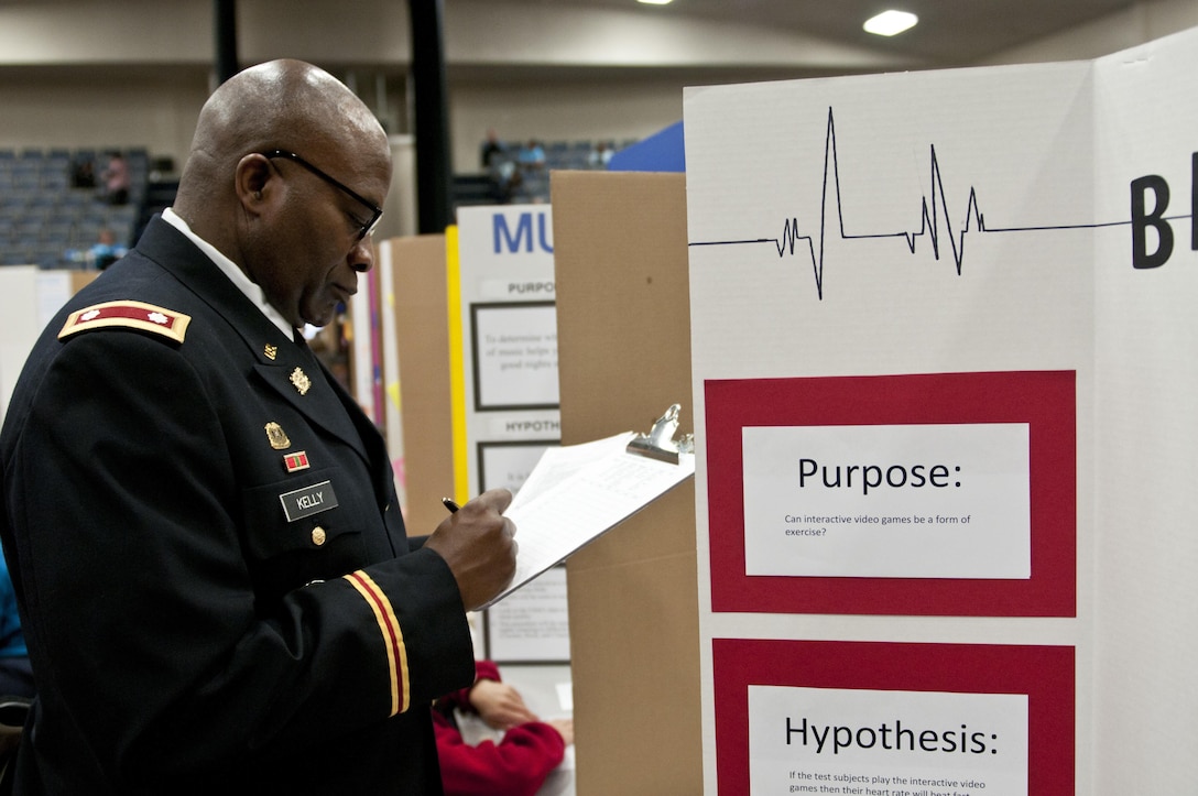 U.S. Army Reserve Lt. Col. Allen Kelly, deputy logistics officer, 412th Theater Engineer Command, judges fourth through sixth grade projects at the district science fair at the Vicksburg Auditorium in Vicksburg, Miss., Feb. 23. (U.S. Army photo by Staff Sgt. Debralee Best)
