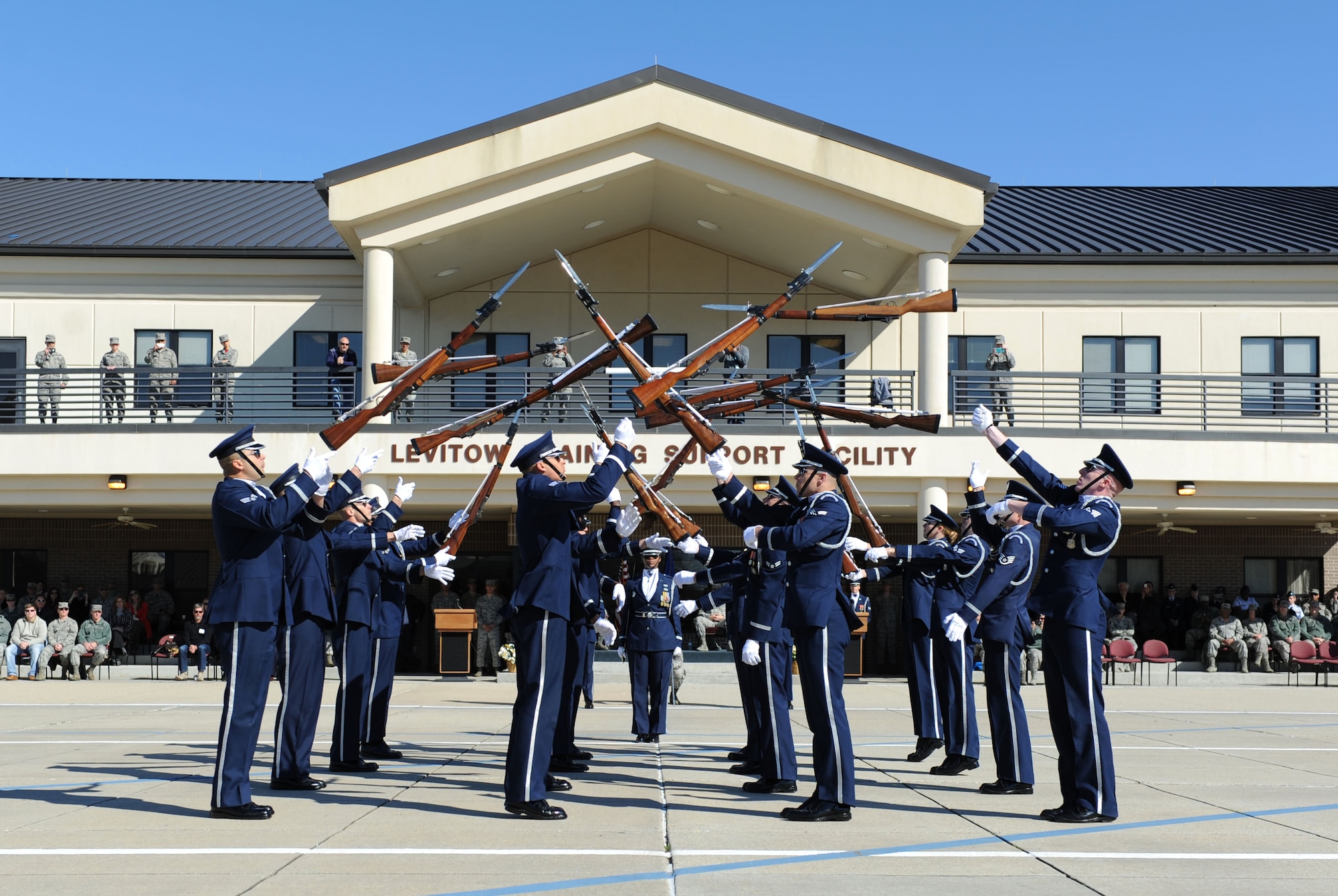 The U.S. Air Force Honor Guard Drill Team performs a new routine on the Levitow Training Support Facility drill pad Feb. 26, 2016, Keesler Air Force Base, Miss. During the past month, the team developed the routine to be used throughout the year. (U.S. Air Force photo by Kemberly Groue)