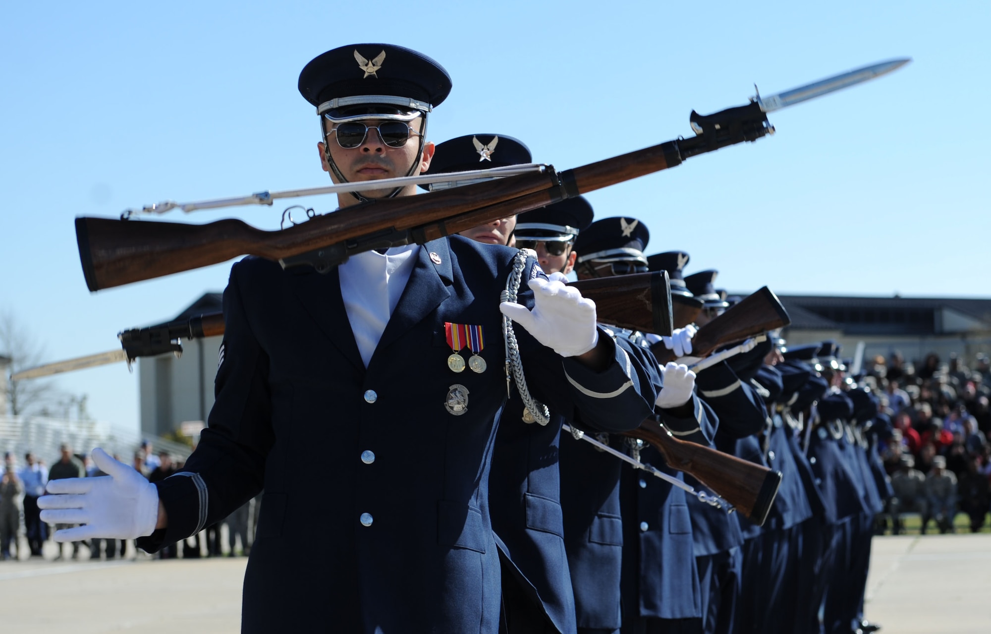 The U.S. Air Force Honor Guard Drill Team performs a new routine on the Levitow Training Support Facility drill pad Feb. 26, 2016, Keesler Air Force Base, Miss. During the past month, the team developed the routine to be used throughout the year. (U.S. Air Force photo by Kemberly Groue)