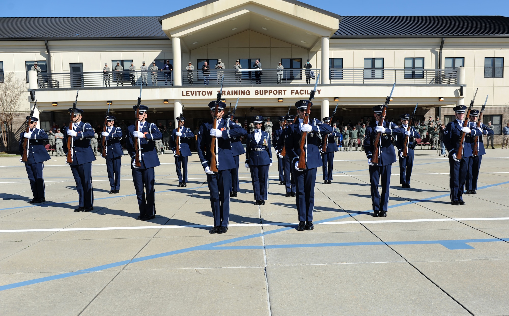 The U.S. Air Force Honor Guard Drill Team performs a new routine on the Levitow Training Support Facility drill pad Feb. 26, 2016, Keesler Air Force Base, Miss. During the past month, the team developed the routine to be used throughout the year. (U.S. Air Force photo by Kemberly Groue)