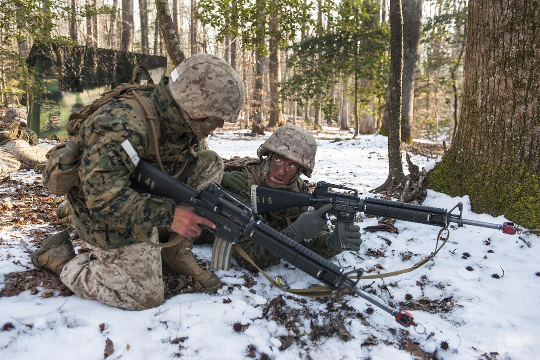 Marine Corps officer candidates discus their next movement during a small-unit leadership evaluation at Brown Field on Marine Corps Base Quantico, Va., Feb. 18, 2016. Marine Corps photo by Cpl. Patrick H. Owens