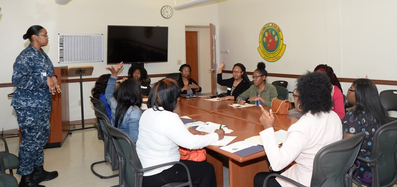 Petty Officer 1st Class Antresha Holmes gives an overview of health professions to Dougherty County High School Students recently during a job shadowing event held at the Naval Branch Health Clinic aboard the Marine Corps Logistics Base Albany. 