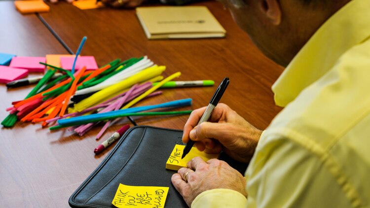 A participant at the Marine Corps Warfighting Lab’s Force Development 25 Innovation Symposium writes down common problems with leadership in the Marine Corps at Marine Corps Base Quantico, Virginia, Feb. 24, 2016. Participants at the event were put into workshops where they had to find problems with the Marine Corps and ways to solve them.