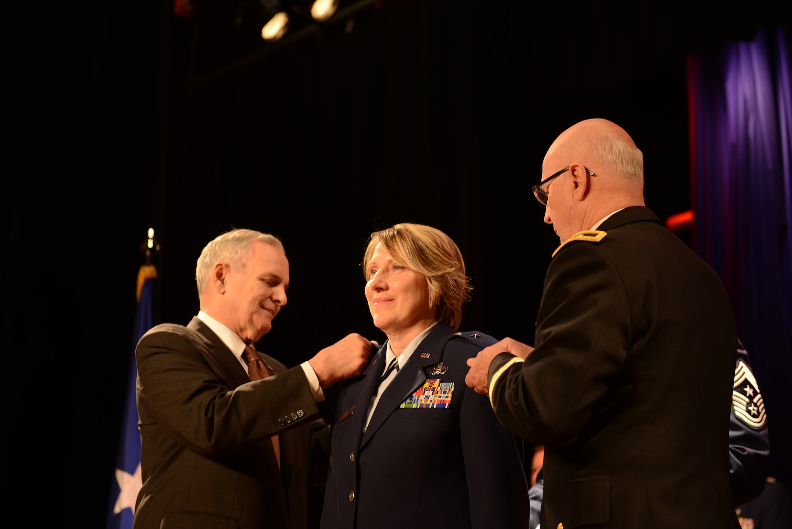 Air Force Col. Sandra L. Best is promoted to brigadier general by Minnesota Gov. Mark Dayton and Minnesota National Guard Adjutant General Maj. Gen. Richard Nash during a ceremony, February 25, 2016, in Minneapolis. Best is the first female general officer in the Minnesota National Guard. 