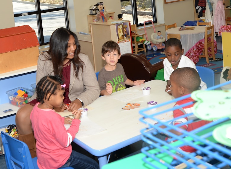 Brianna Foster, Westover High School senior, interacts with children during her job shadowing experience recently at the Children’s Development Center aboard the Marine Corps Logistics Base Albany.