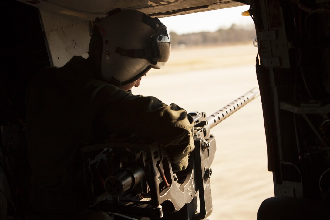 Lance Cpl. Samantha Alaw mounts a .50-caliber machine gun onto a CH-53E Super Stallion during Exercise Eager Response at Marine Corps Air Station Beaufort, S.C., Feb. 25, 2016. During Exercise Eager Response, Marines trained in events such as casualty evacuation, assault support missions and aerial refueling, proving the Marine Air-Ground Task Force is a highly effective combat force. Alaw is a CH-53E crew chief with Marine Heavy Helicopter Squadron 366. (U.S. Marine Corps photo by Pfc. Nicholas P. Baird/Released)