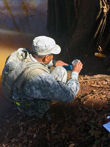 Spc. Fearon Williams, a water treatment specialist, with the 574th Quarter Master, 17th Combat Sustainment Support Battalion, tests the water for the amount of chlorine found in the source water before the purification process can begin at Fort Polk, La. The purification process purifies 1,500 gallons of water per hour; this process allows for sustainment capabilities for Soldiers within the training grounds.