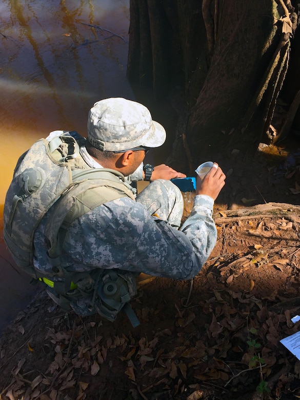 Spc. Fearon Williams, a water treatment specialist, with the 574th Quarter Master, 17th Combat Sustainment Support Battalion, tests the water for the amount of chlorine found in the source water before the purification process can begin at Fort Polk, La. The purification process purifies 1,500 gallons of water per hour; this process allows for sustainment capabilities for Soldiers within the training grounds.