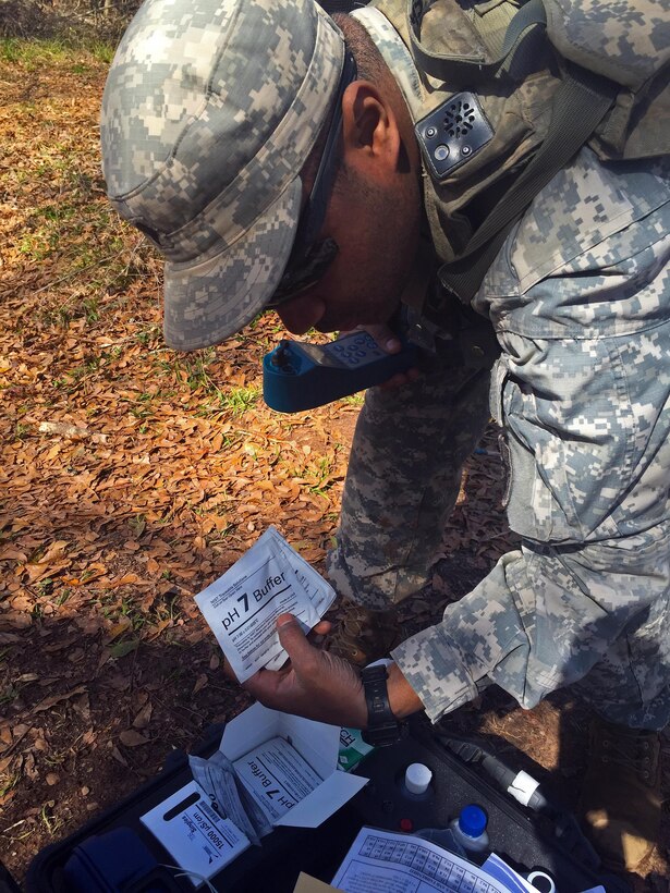 Spc. Fearon Williams, a water treatment specialist, with the 574th Quarter Master, 17th Combat Sustainment Support Battalion pulls one of the tests used to ensure the quality of the water before it can be purified for consumption at Fort Polk, La. Williams is an active duty Soldier working to support a Reservist unit. (U.S. Army Reserve Photo by Sgt. Bethany L. Huff)