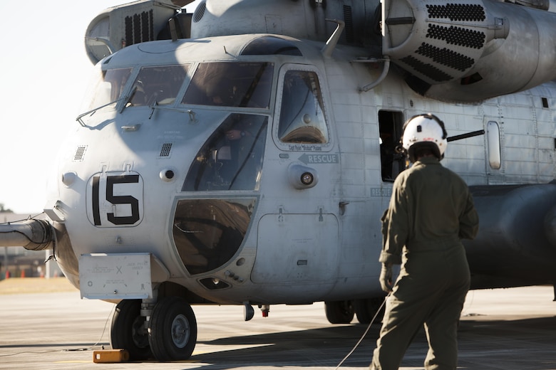 Lance Cpl. Samantha Alaw inspects a CH-53E Super Stallion before flight during Exercise Eager Response at Marine Corps Air Station Beaufort, S.C., Feb. 25, 2016. During the exercise, Marines trained in events such as casualty evacuation, assault support missions and aerial refueling, proving the Marine Air-Ground Task Force is a highly effective combat force. Alaw is a CH-53E crew chief with Marine Heavy Helicopter Squadron 366. (U.S. Marine Corps photo by Pfc. Nicholas P. Baird/Released)