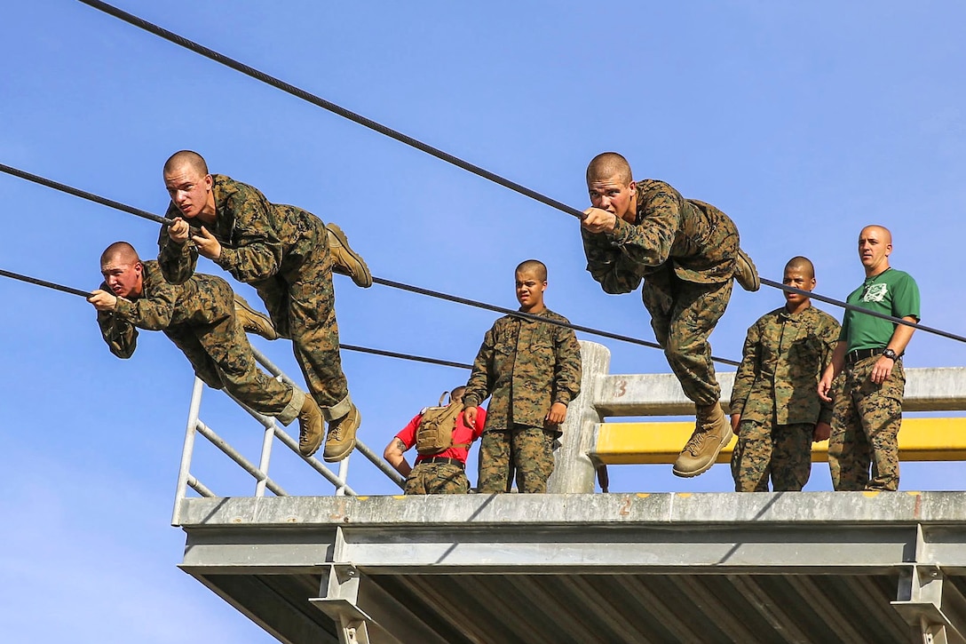 Marine Corps recruits participate in the slide-for-life obstacle during the confidence course on Marine Corps Recruit Depot San Diego, Feb. 23, 2016. Marine Corps photo by Lance Cpl. Angelica I. Annastas 