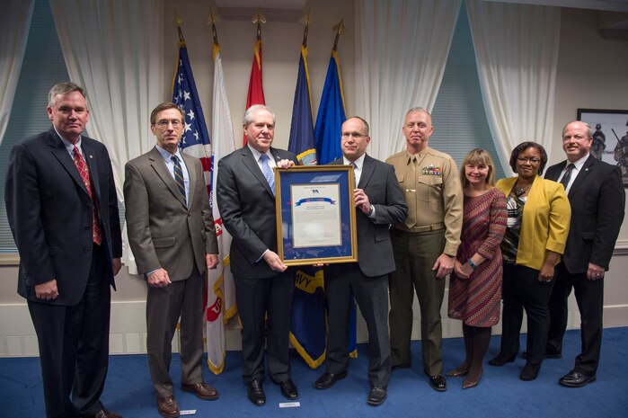 Under Secretary of Defense for Acquisition, Technology and Logistics Frank Kendall presents the David Packard Excellence in Acquisition Award to the Program Executive Officer Land Systems Ground/Air Task Oriental Radar Team during a ceremony at the Pentagon Feb. 19. G/ATOR is a next-generation radar that provides air surveillance/air defense, counter-fire target acquisition, and air traffic control capabilities. (DOD photo by Master Sgt. Adrian Cadiz)