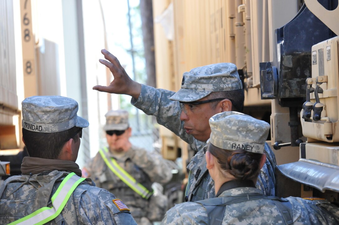 Soldiers from the 103rd Quartermaster Company in Houston, huddle before inspecting food coolers Feb. 17, 2016, at Fort Polk, La., as part of the unit’s supporting role during a field exercise involving joint and multinational operations. The 103rd Quartermaster Company is responsible for Class I supplies that encompasses food for service members in the field. (U.S. Army photo by Sgt. Brandon Hubbard, 204th PAD)