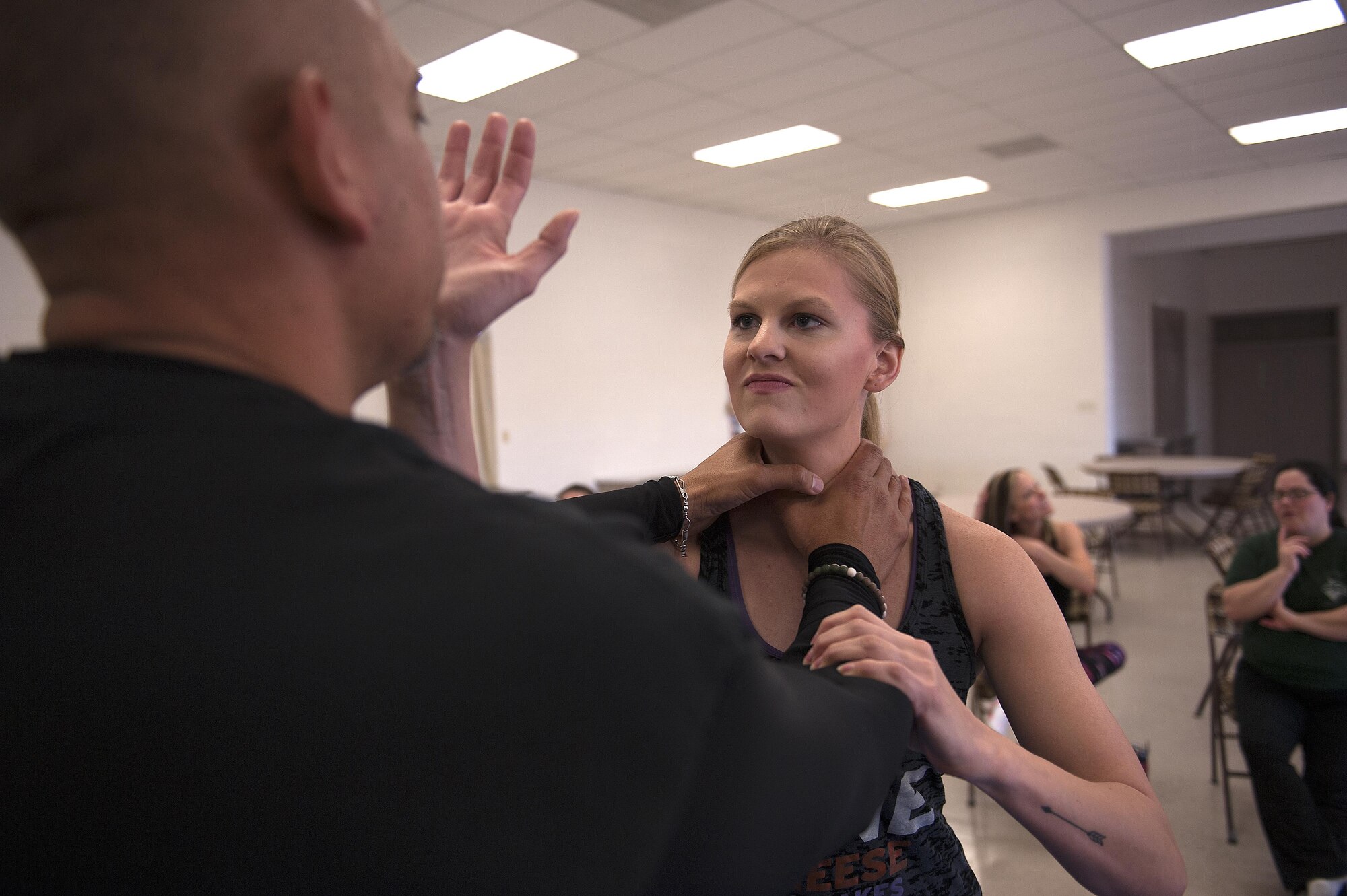 U.S. Air Force Staff Sgt. Adriene Anderson, 315th Training Squadron instructor, performs a palm strike to the face during a self-defense class at St. Marks Presbyterian Church, San Angelo, Texas, Feb. 27, 2016. Anderson initiated the Mommy Fit Camp program in August of 2015 as part of the Make Goodfellow Great Initiative for Goodfellow Air Force Base. (U.S. Air Force photo by Airman 1st Class Caelynn Ferguson/Released)