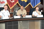 DLA Logistics Operations Director Navy Rear Adm. Vince Griffith (middle) describes the agency’s mission to Coast Guard Rear Adm. Bill Kelly, commander of the Coast Guard’s Personnel Service Center (left), and Coast Guard Rear Adm. Bruce Baffer, the Coast Guard’s assistant commandant for engineering and logistics (right).