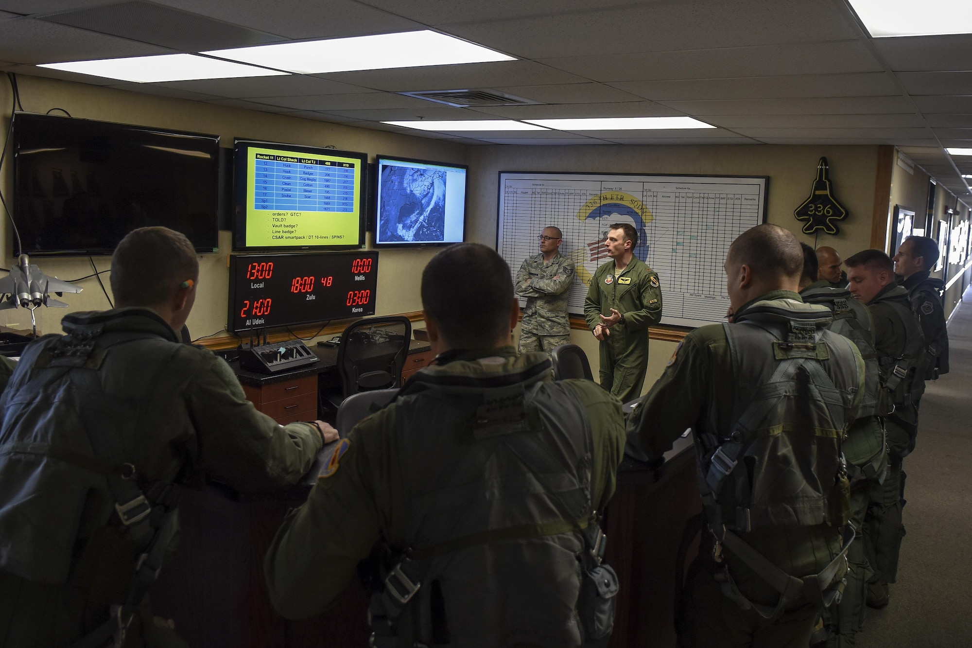 Aircrew members from the 336th Fighter Squadron receive a pre-flight briefing, Feb. 25, 2016, at Seymour Johnson Air Force Base, North Carolina. About 28 members flew to Nellis Air Force Base, Nevada to participate in a large force joint collision exercise known as Red Flag that aims to train crews in air, space and cyberspace combat scenarios. (U.S. Air Force photo/Airman Shawna L. Keyes)