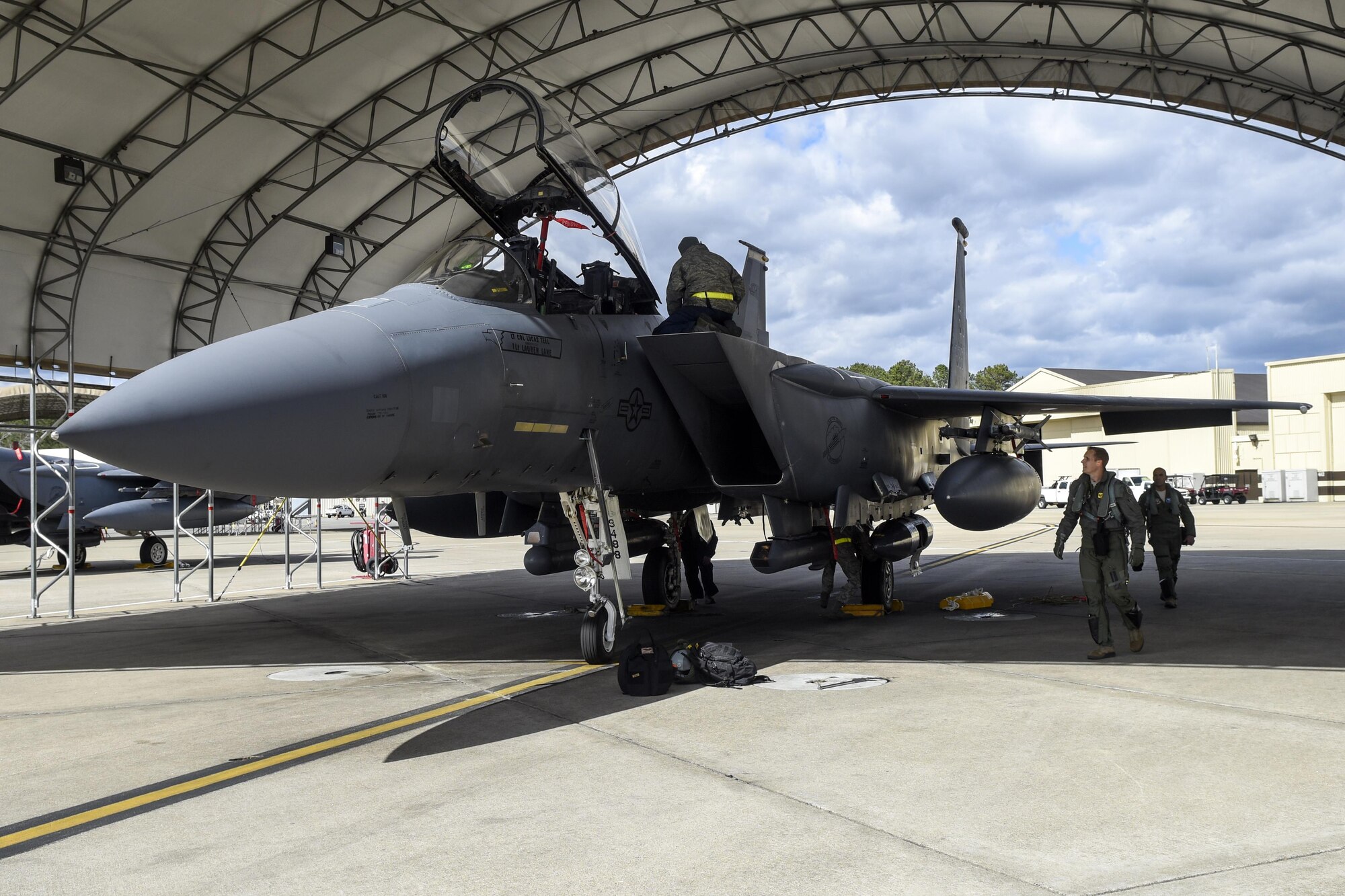 Air and ground crew prepare an F-15E Strike Eagle for departure to Nellis Air Force Base, Nevada, Feb. 25, 2016, at Seymour Johnson Air Force Base, North Carolina. 14 Strike Eagles took off to participate in Red Flag 16-2, a large force joint collision exercise. (U.S. Air Force photo/Airman Shawna L. Keyes) 