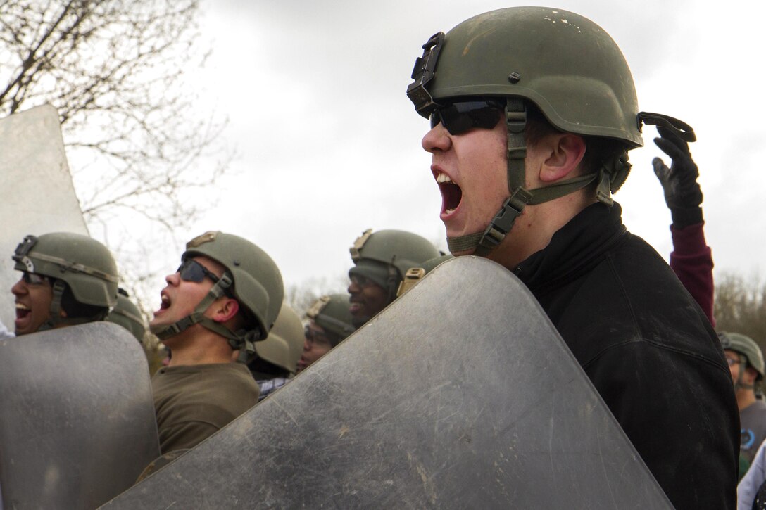 A mock protester taunts U.S. soldiers during an exercise at the Joint Multinational Readiness Center in Hohenfels, Germany, Feb. 25, 2016. The soldiers are assigned to the 1st Battalion, 41st Infantry Regiment, 2nd Infantry Brigade Combat Team. The training was part of crowd control training. Army photo by Staff Sgt. Thomas Duval