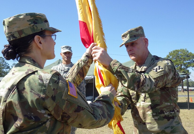 U.S. Army Col. Jeffrey L. Richar, commander of the 642nd Regional Support Group, hands the unit colors back to Command Sgt. Maj. Jane Baldwin, as Brig. Gen. Francisco A. Espaillat, commander of the 143rd Sustainment Command (Expeditionary), looks on during the brigade's change of command ceremony Feb. 28 at Fort Stewart, Ga. Richar took over command from Col. James T. Wilson. The Army Reserve unit, based in Decatur, Ga., serves as headquarters for thousands of support Soldiers throughout the southeastern United States. It falls under the 143rd ESC.