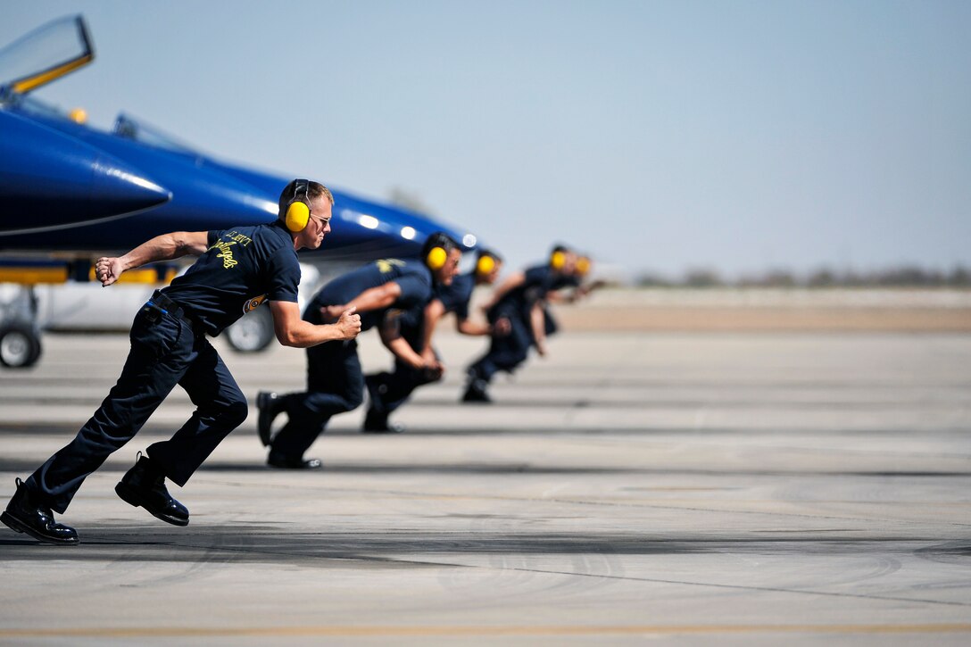 Crew chiefs for the Blue Angels, the Navy’s flight demonstration squadron, set off to launch jets during a practice demonstration at Naval Air Facility El Centro, Calif., Feb. 27, 2016. The Blue Angels are conducting winter training before kicking off the 2016 show season. Navy photo by Petty Officer 2nd Class Daniel M. Young