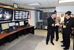 GREAT LAKES, Ill. (Feb. 29, 2016) Capt. Douglas Pfeifle, commanding officer of  Recruit Training Command (RTC), shows Vice Adm. Jin-Sup Jung, the Republic of Korea (ROK) Navy commander of Naval Education and Training, a personal data assistant (PDA) in the Master Control Room of the U. S. Navy’s largest simulator, USS Trayer (BST 21), a 210-foot-long Arleigh Burke-class destroyer replica, where recruits go through Battle Stations, a grueling 12-hour culmination of basic training and the last evolution recruits accomplish before they graduate. 
