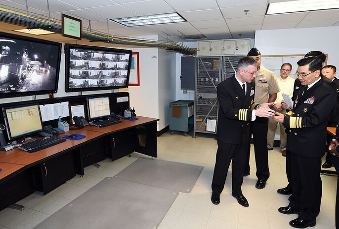 GREAT LAKES, Ill. (Feb. 29, 2016) Capt. Douglas Pfeifle, commanding officer of  Recruit Training Command (RTC), shows Vice Adm. Jin-Sup Jung, the Republic of Korea (ROK) Navy commander of Naval Education and Training, a personal data assistant (PDA) in the Master Control Room of the U. S. Navy’s largest simulator, USS Trayer (BST 21), a 210-foot-long Arleigh Burke-class destroyer replica, where recruits go through Battle Stations, a grueling 12-hour culmination of basic training and the last evolution recruits accomplish before they graduate. 

