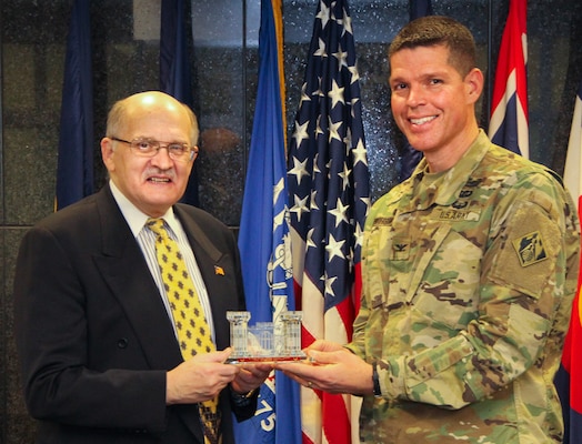 Rick Totten, District Counsel for the Omaha District was honored with the iconic crystal castle, presented by Colonel John Henderson during a retirement ceremony.
