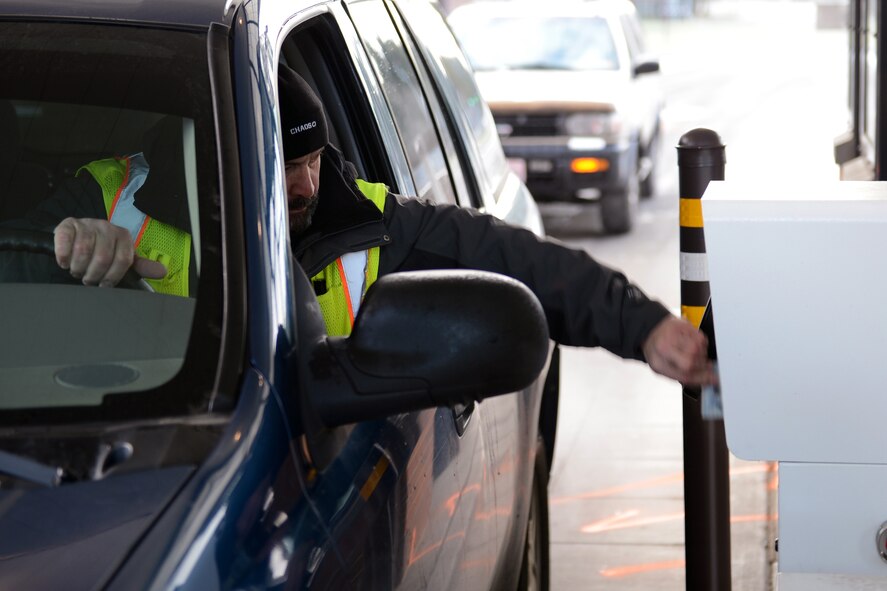 Dave Horne, physical security inspector and automated installation entry system project leader, uses the AIE system to go through McChord Field’s Barnes Gate at Joint Base Lewis-McChord, Wash. A standard Washington State Driver License or ID Card can no longer be used to get a visitor’s pass for access to Joint Base Lewis-McChord or the Yakima Training Center starting April 1, because neither complies with Real ID Act of 2005 requirements. (U.S. Air Force photo/Airman 1st Class Jacob Jimenez)