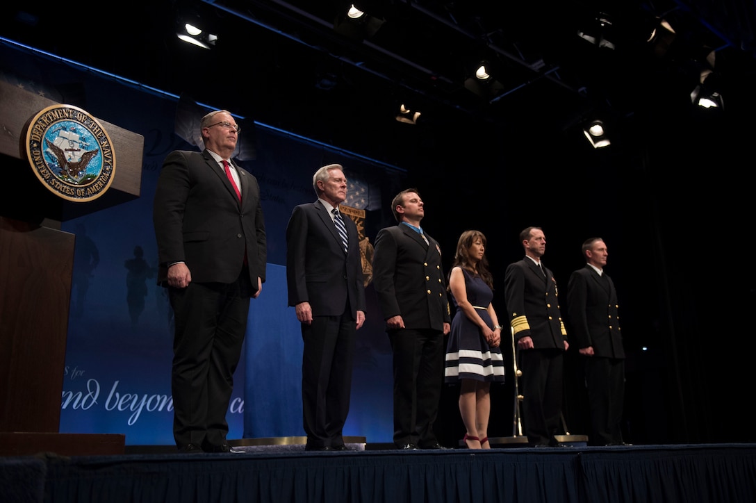 Deputy Defense Secretary Bob Work, left, participates in the ceremony to induct Navy Senior Chief Petty Officer Edward C. Byers Jr. Edward Byers into the Hall of Heroes at the Pentagon, March 1, 2016. DoD photo by Air Force Senior Master Sgt. Adrian Cadiz