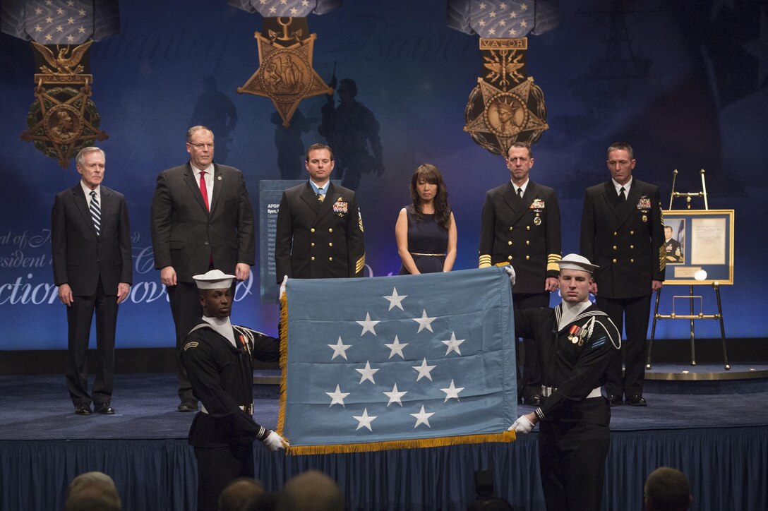 Navy Secretary Ray Mabus, left, Deputy Defense Secretary Bob Work, second from left, and Navy Senior Chief Petty Officer Edward C. Byers Jr. participate in a ceremony to induct Byers into the Hall of Heroes at the Pentagon, March 1, 2016. DoD photo by Air Force Senior Master Sgt. Adrian Cadiz