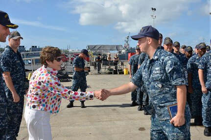 151109-N-EF781-017 PEARL HARBOR (NOV. 9, 2015) Mayor Patty Lent of Bremerton, Wash., congratulates Sonar Technician 3rd Class Tyler Unger on being awarded the “Tactical Adonis Award” from the Bremerton-Olympic Peninsula Council of the Navy League. This award represents outstanding achievement and excellence in weapons and tactical operations. (U.S. Navy photo by Lt. Brett Zimmerman/Released)