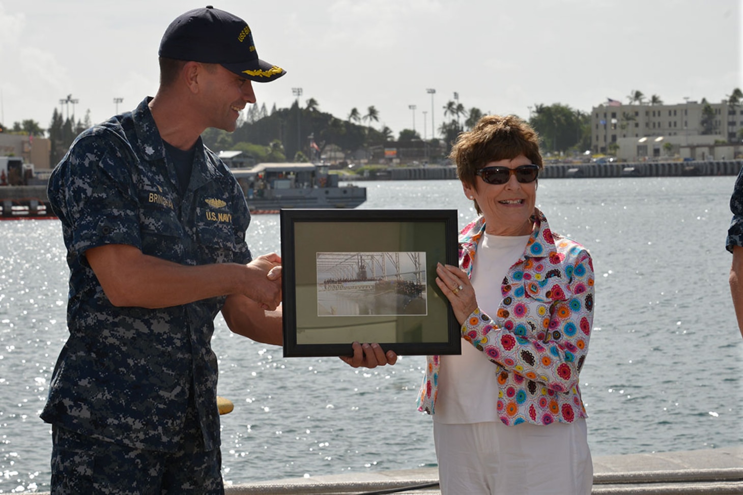 151109-N-EF781-047 PEARL HARBOR (NOV. 9, 2015) Cmdr. Wes Bringham presents a photograph of the USS Bremerton as a gift to the mayor of Bremerton, Wash., Patty Lent.  Bringham told Mayor Lent he appreciates all the support his crew receives from the city of Bremerton and the Navy League chapter located there. (U.S. Navy photo by Lieutenant Brett Zimmerman/Released)