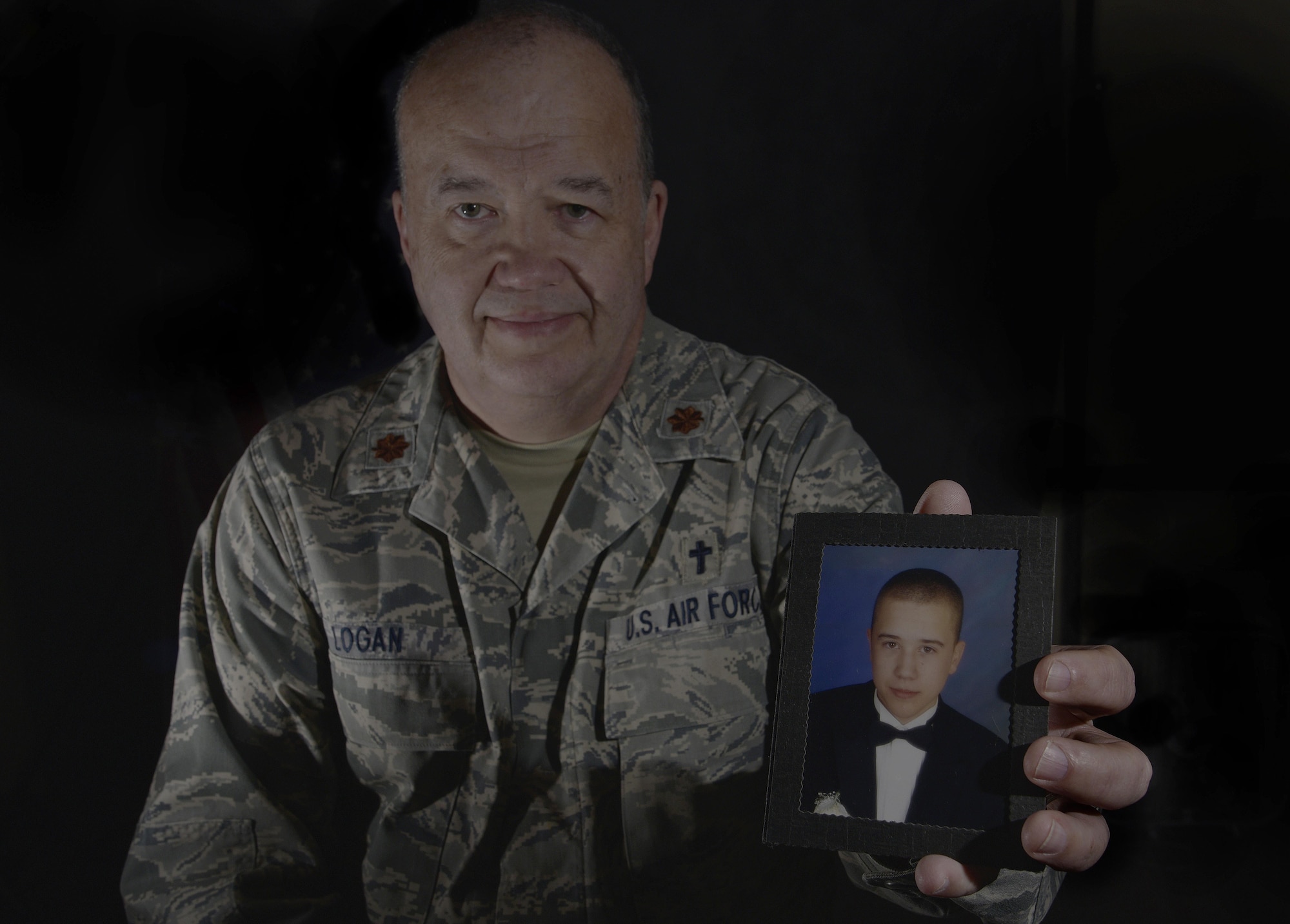 U.S. Air Force Maj. William Logan, a chaplain with the 35th Fighter Wing, holds a picture of his son, Zac, at Misawa Air Base, Japan, Feb. 23, 2016. Logan shared the story of his son’s suicide and the effects of the aftermath. He highlighted the recovery process hoping to inspire others to come forward for help in times of need. Logan is from Medina, Tennessee. (U.S. Air Force photo by Airman 1st Class Jordyn Fetter/Released)