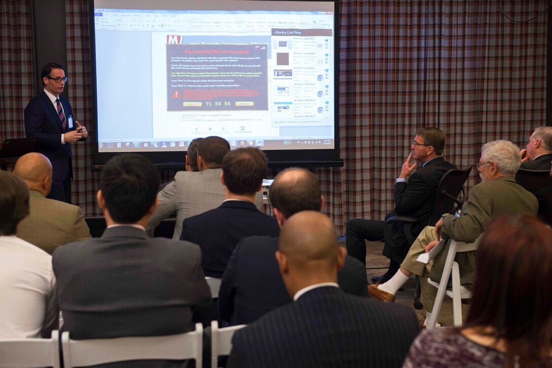 Defense Secretary Ash Carter listens to a technology demonstration at Galvanize San Francisco, March 1, 2016. Carter is on a trip to California and Washington state to discuss technology, cybersecurity initiatives and other topics with tech leaders. DoD photo by Navy Petty Officer 1st Class Tim D. Godbee