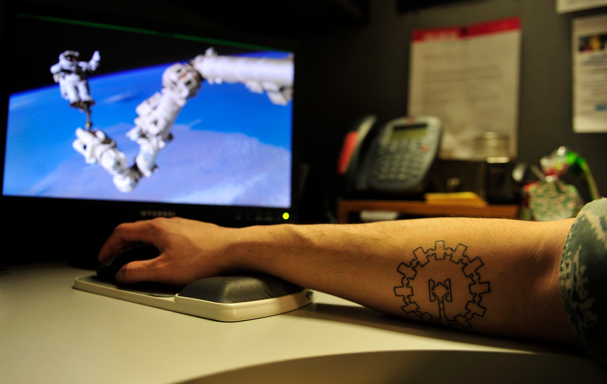 Airman 1st Class Fabian Miranda-Corpuz’s, 28th Comptroller Squadron budget analyst, space station tattoo serves as a constant reminder to pursue his dreams and stay motivated every day. Miranda-Corpuz applied for and was accepted into a commissioning program which he hopes can lead to his dream of working on spacecraft. (U.S. Air Force photo by Airman 1st Class James L. Miller/Released)