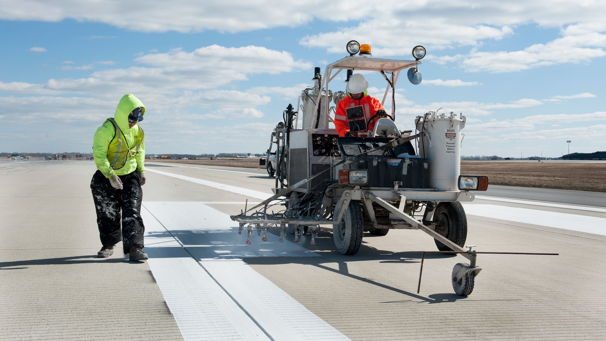 A crew from Mullen’s Markings repaints Runway 14-32 as part of an ongoing runway construction project Feb. 26, 2016, at Dover Air Force Base, Del. Runway 14-32 is temporarily being shortened from 12,900 feet to 6,000 feet to allow construction on its intersection with Runway 01-19. (U.S. Air Force photo/Senior Airman Zachary Cacicia)