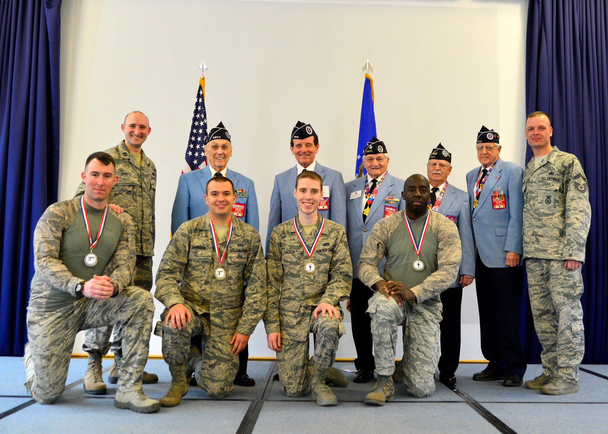 Members of the third place overall team and the first military team to finish the 436th Security Forces Squadron 17th Annual Korean War Ruck March pose with 436th SFS leadership and members of the Korean War Veterans Association March Feb. 27, 2016, at Dover Air Force Base, Del. The top three teams and the first place individual runner were recognized and presented medals. (U.S. Air Force photo/Tech. Sgt. Elizabeth Morris)