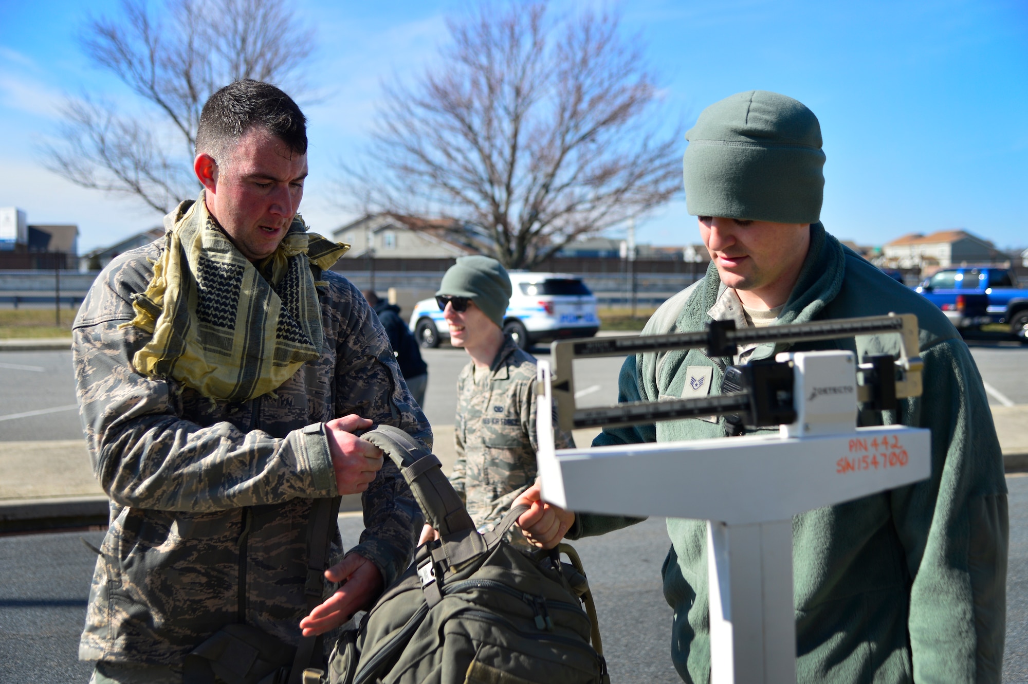 Staff Sgt. Thomas Faivre, right, 436th Security Forces Squadron unit deployment manager, weighs the ruck sack of Tech. Sgt. Clayton Morris, 436th Operations Support Squadron Air Crew Flight Equipment production NCO in charge, during the 436th SFS 17th Annual Korean War Ruck March Feb. 27, 2016, at Dover Air Force Base, Del. To qualify for an award, each participant must have had a minimum of 30-pounds in their ruck sack. (U.S. Air Force photo/Tech. Sgt. Elizabeth Morris)