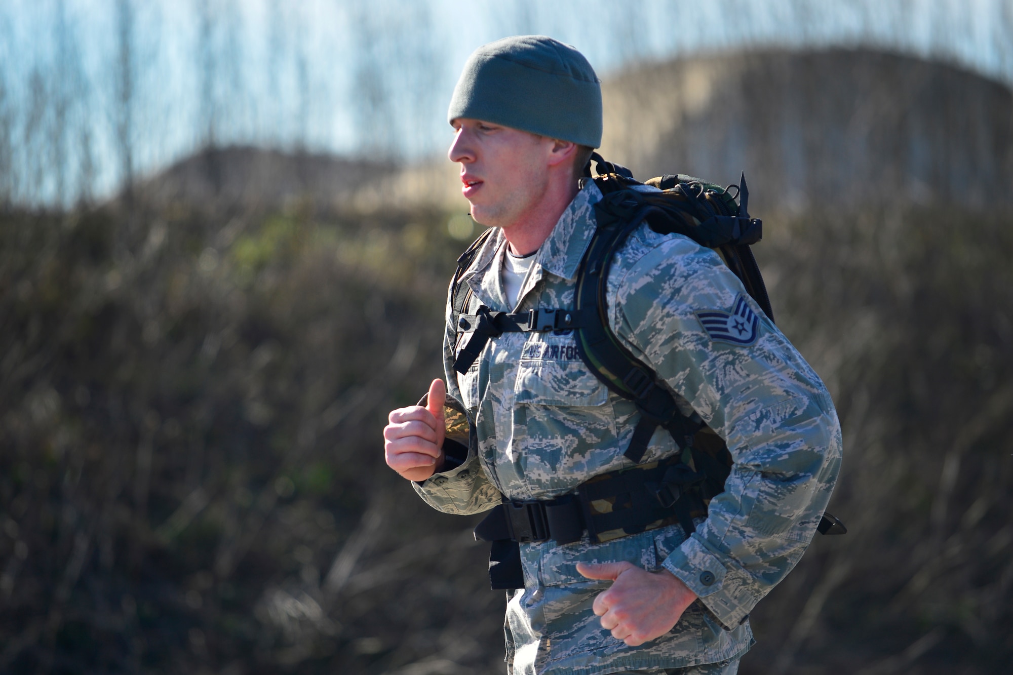 Staff Sgt. Brian Lecates, 436th Force Support Squadron Airmen Leadership School instructor, competes in the 436th Security Forces Squadron 17th Annual Korean War Ruck March Feb. 27, 2016, at Dover Air Force Base, Del. The ruck march was 6.2 miles long and began and ended at the Landings. (U.S. Air Force photo/Tech. Sgt. Elizabeth Morris)