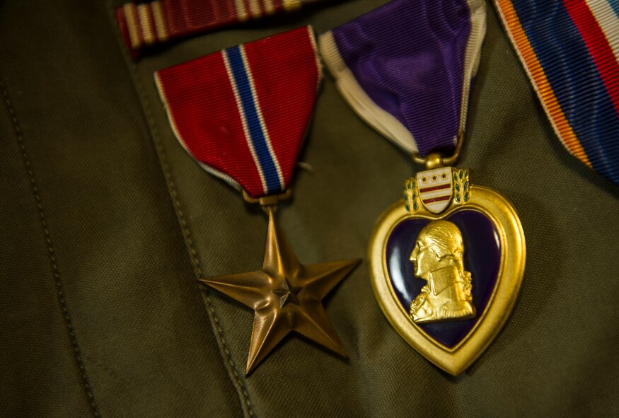 The Bronze Star and Purple Heart medals hang from U.S. Army Private 1st Class (Sep.) Lynn Aas’ jacket during an interview at the Dakota Territory Air Museum in Minot, N.D., Feb. 18, 2016. Aas was awarded these prestigious medals for the sacrifices he made during his time as a combat infantryman during the Battle of the Bulge. (U.S. Air Force photo/Senior Airman Apryl Hall)