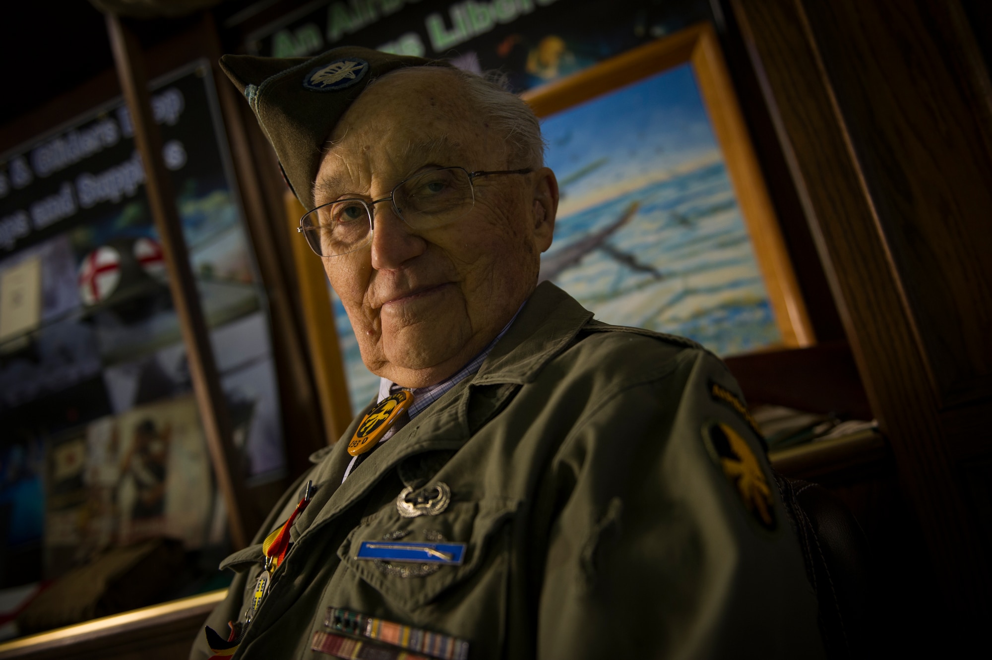 U.S. Army Private 1st Class (Sep.) Lynn Aas, 17th Airborne Division combat infantry rifleman, poses for a photo at the Dakota Territory Air Museum in Minot, N.D., Feb. 18, 2016. Aas served during the Battle of the Bulge and was awarded the Bronze Star and Purple Heart for his sacrifices. (U.S. Air Force photo/Senior Airman Apryl Hall)